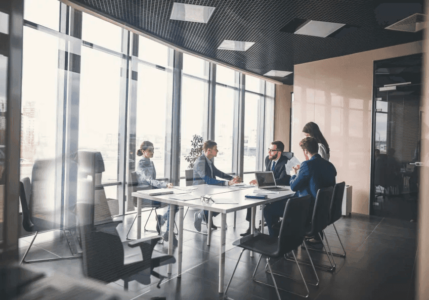 Multiple people attending a business meeting