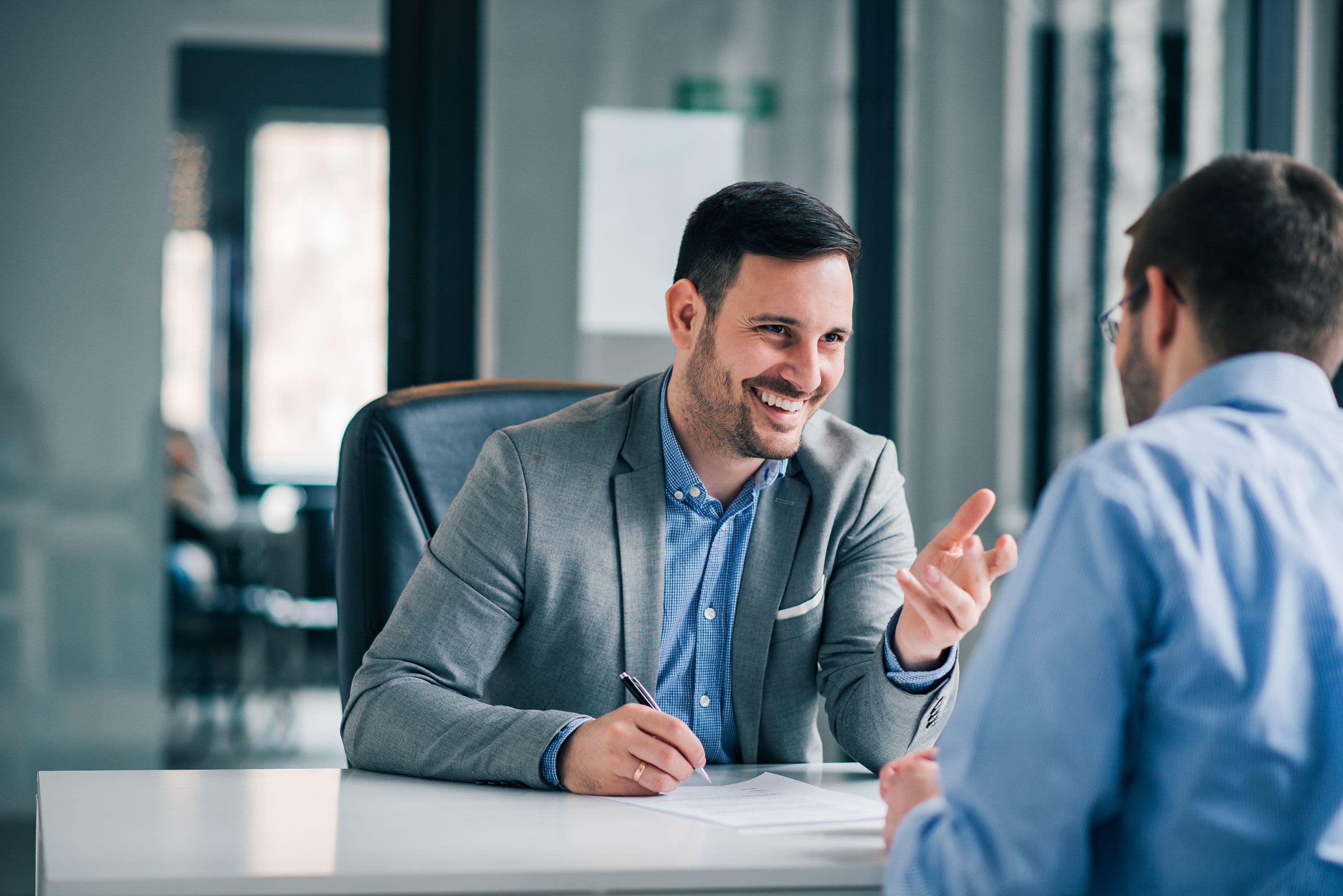 Two people having a business meeting sitting opposite to one another
