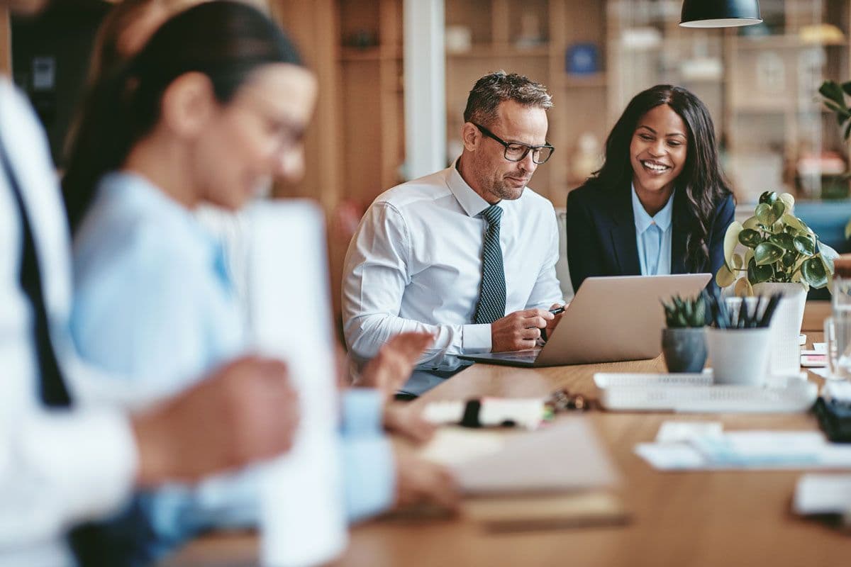 Business people sitting around a table for a meeting