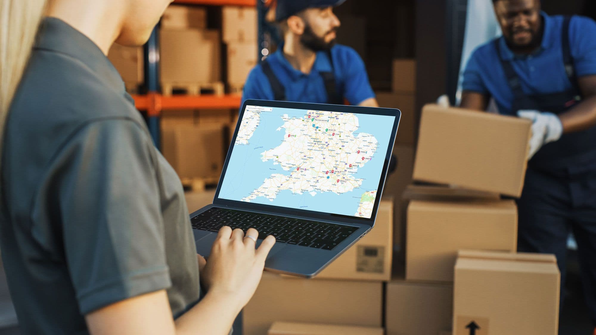 An employee looking at a map on their laptop